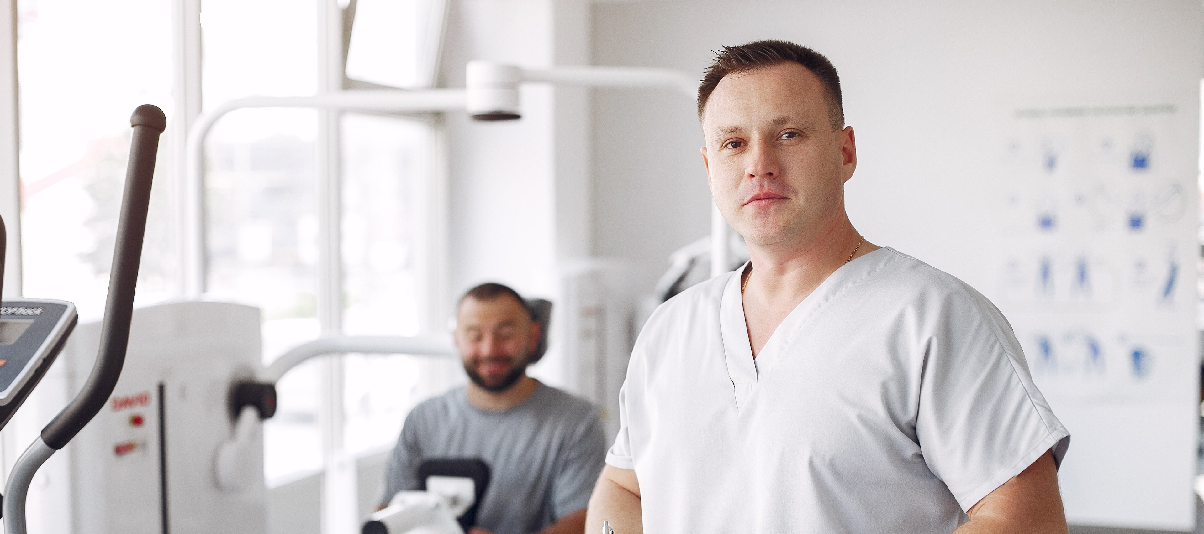 Doctor working with patient in physiotherapy clinic